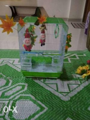 Bird Cage with food and water keeper and some
