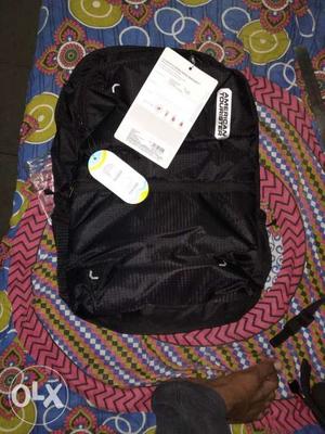 Black American tourister laptop bag and traveller