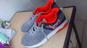 Pair Of Gray-and-orange AIR Running Shoes size UK8