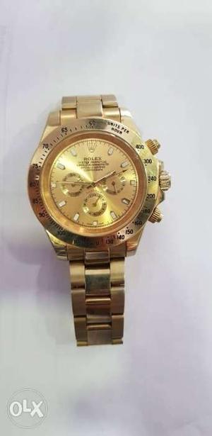 Round Gold Rolex Chronograph Watch With Link Bracelet