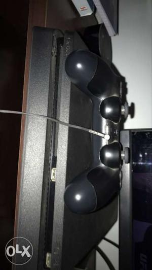 Sony PlayStation 4 1TB with 2 controllers 1 yr old