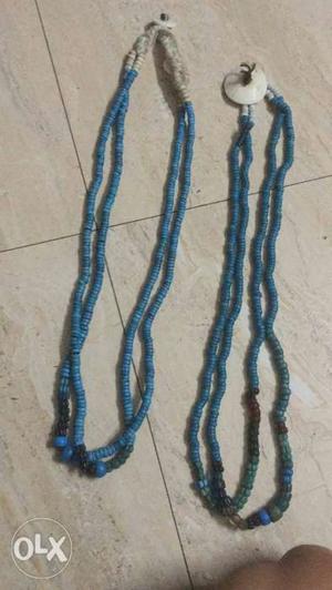 Two Black And One Blue Beaded Necklaces