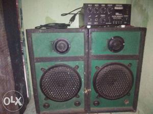Two Green And Black Speakers