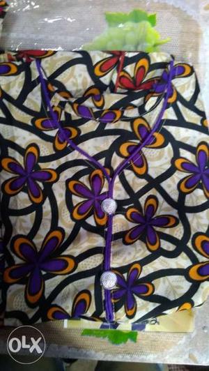 White, Purple, And Red Floral Textile