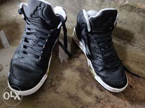 Pair Of Black Air Jordan 5's