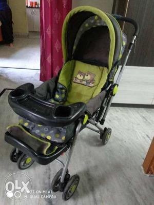 Baby's Green And Pink Jogging Stroller