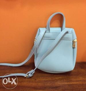 Brand new sky blue sling pouch,, Mniso brand