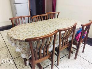 Oval Brown Wooden Table With Six shesham Chairs Dining Set.