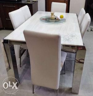 Single white marble dining table with 6 chairs