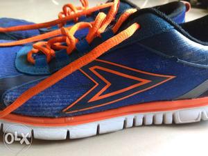 Unpaired Blue And Orange New Balance Running Shoe