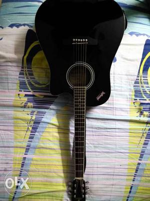 It is a 1.6 years old Pluto semi acoustic guitar