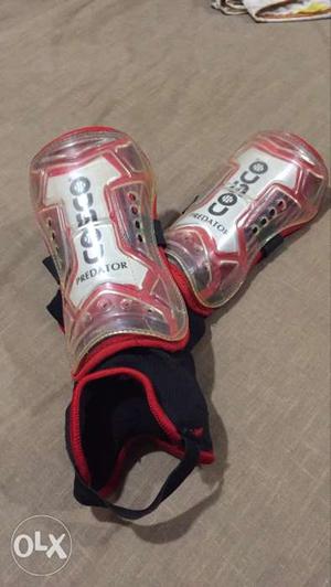 Pair Of Red-and-white Shin guards