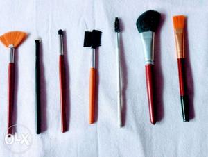 Five Red And Black Makeup Brushes