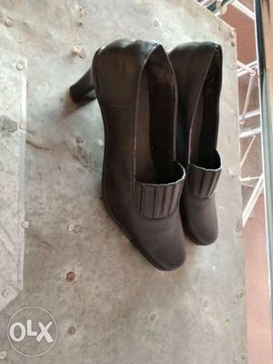 Pair Of Black Leather Boots