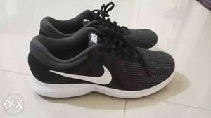 Pair Of Black Nike Running Shoes