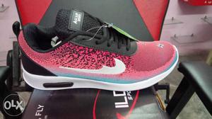 Unpaired Black And Pink Nike Basketball Shoe