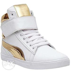 Unpaired White And Gold Puma High-top Sneakers