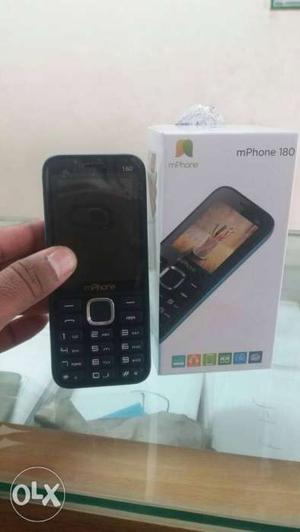 Brand new basic handset with charger and box.