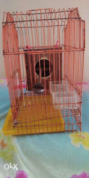 Two Brown And White Metal Bird Cages