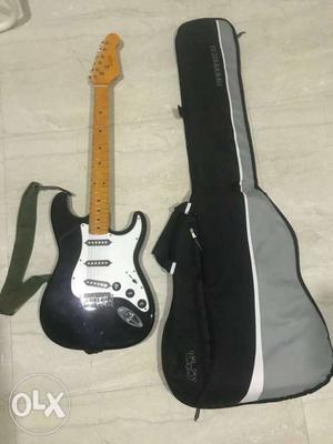 Black And White TGM Electric Guitar With Gig Bag