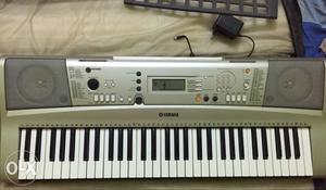Grey And Silver Electronic Keyboard