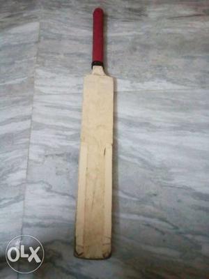 It's a wooden cricket bat.harrow/full size
