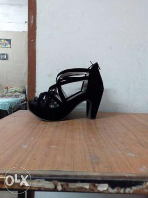 Black velvet crisscross heels.