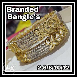 Gold-colored Bangle Bracelets With Text Overla
