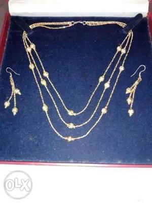 Gold plated necklace with gold beads set for sale.