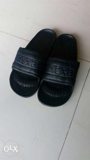 Pair Of Black Leather Slide Sandals