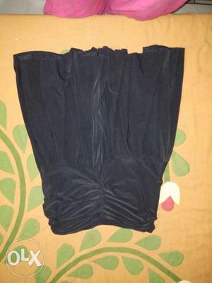 Silk material. Black mini skirt of with stretchy waist.