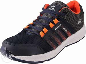 Unpaired Black And Yellow Adidas Running Shoe