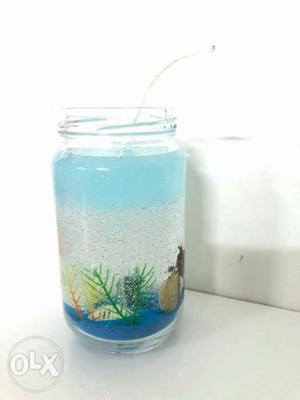 Sea shore theme candle is vanilla scented gel wax