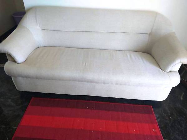 a new unpacked 3 seater sofa with 2 cushions