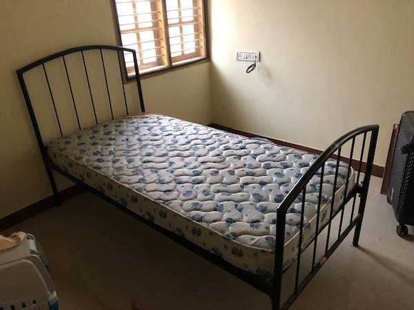 Custom-made king-size iron bed with mattress and side table